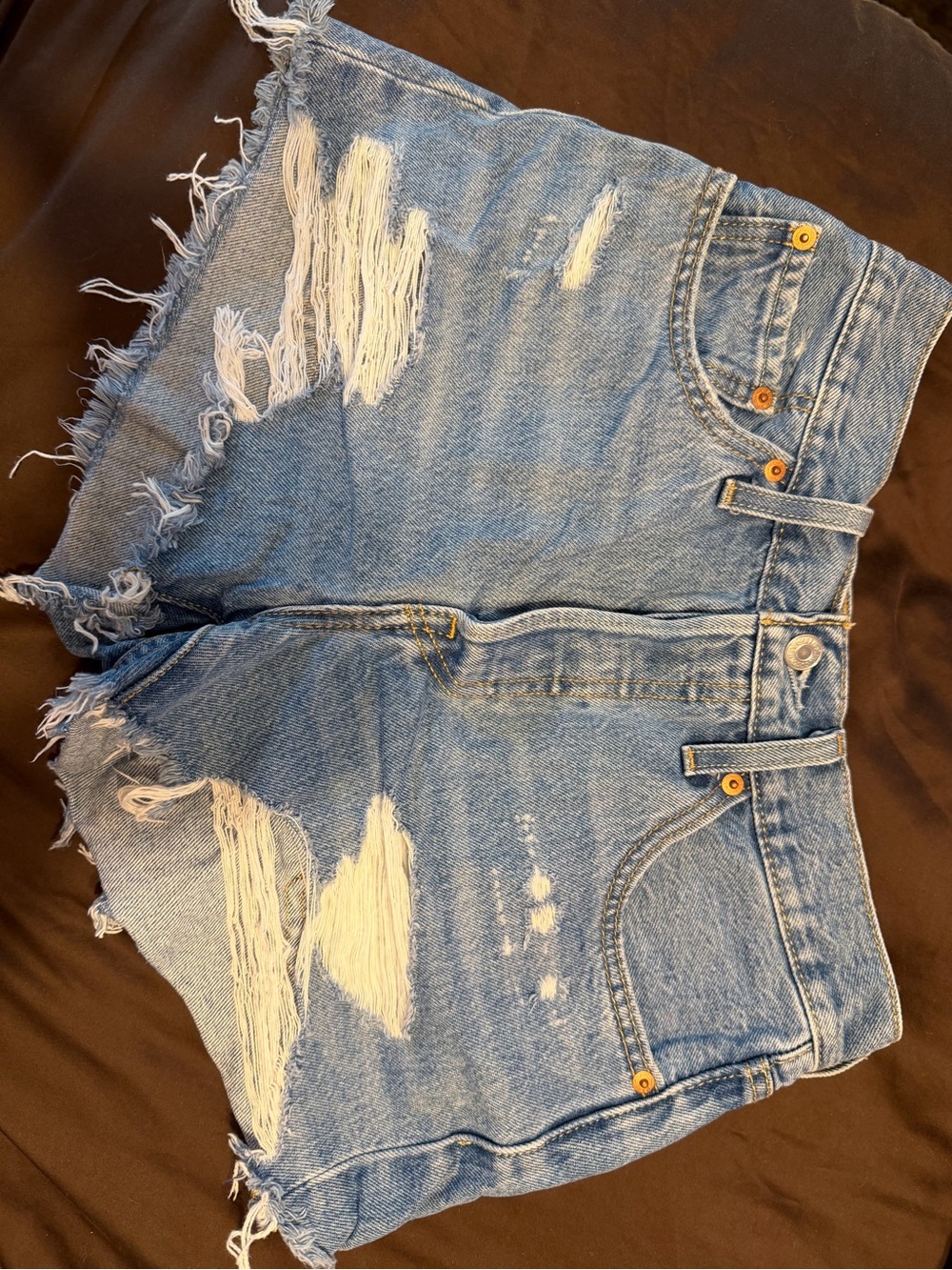 Levi's blue denim shorts with frayed hem